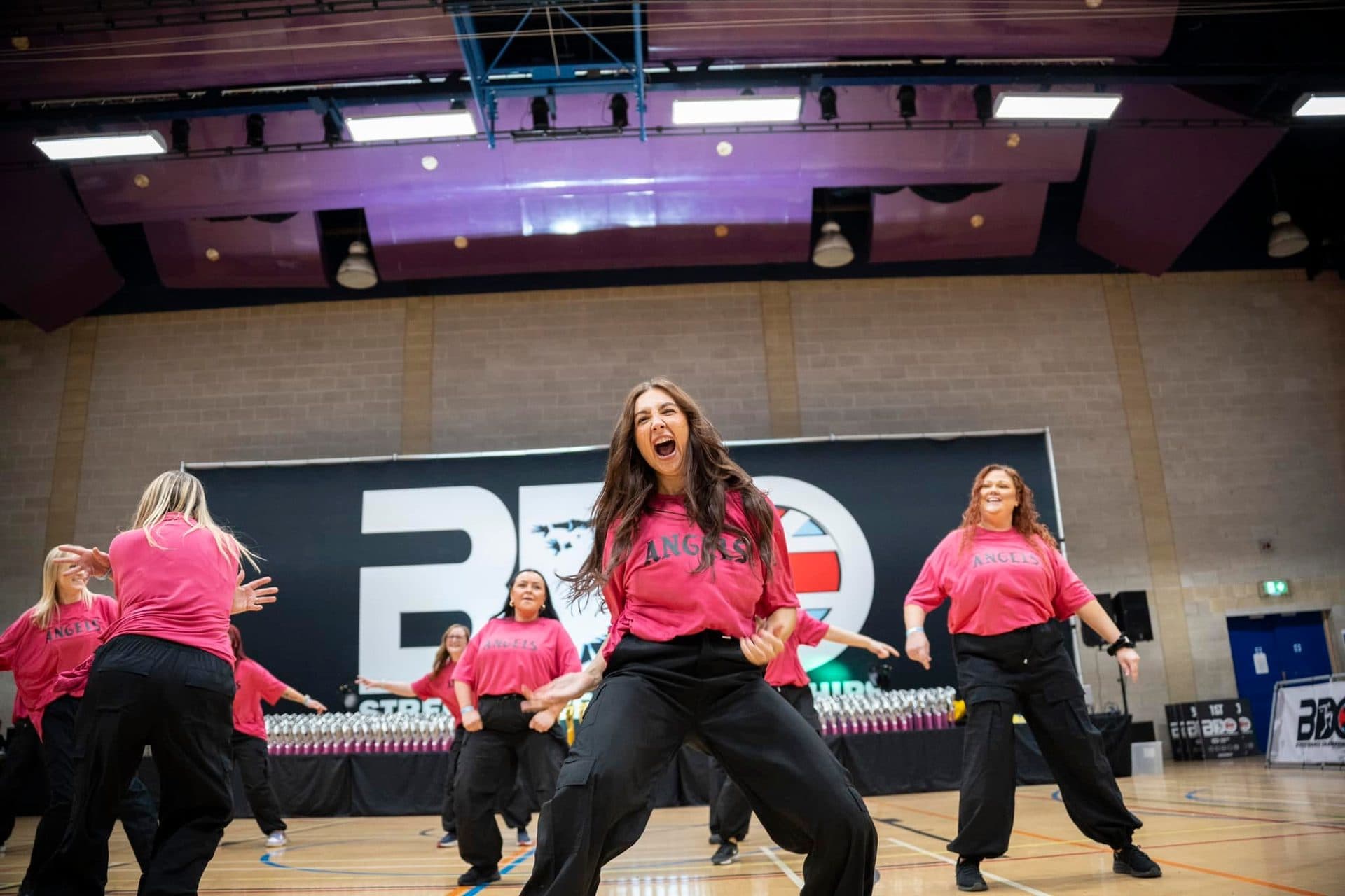 D2E Harry's Angels squad mid-performance at the BDO Championships